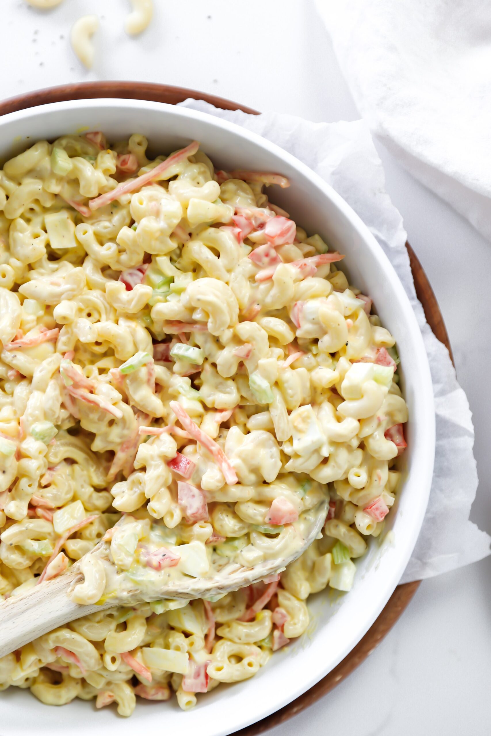 Classic macaroni salad with elbow macaroni, diced vegetables, and a creamy dressing, perfect for summer BBQs and gatherings.