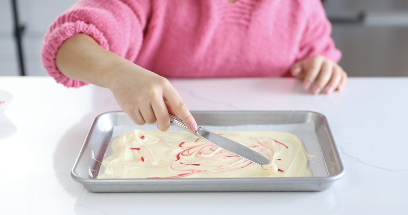 STEP EIGHT: Swirl the food gel in the white chocolate