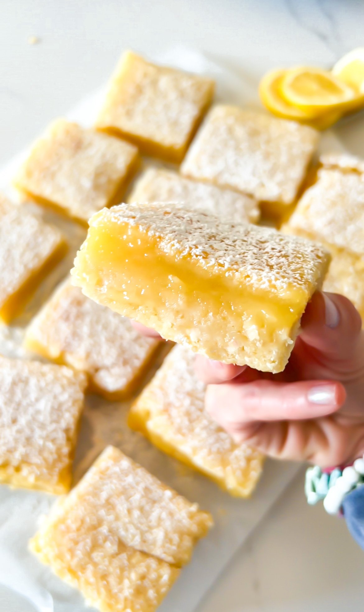 Homemade lemon bar with a tangy, smooth filling.