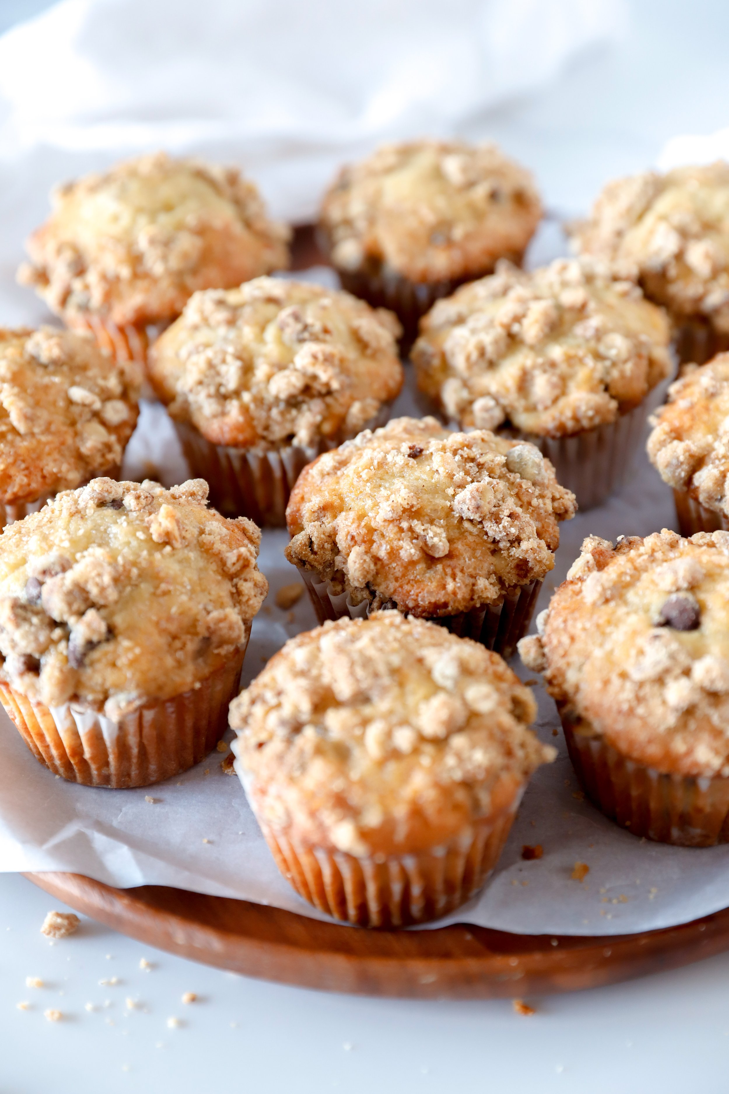 Chocolate chip banana streusel muffins with a crumbly oat topping, fresh out of the oven.