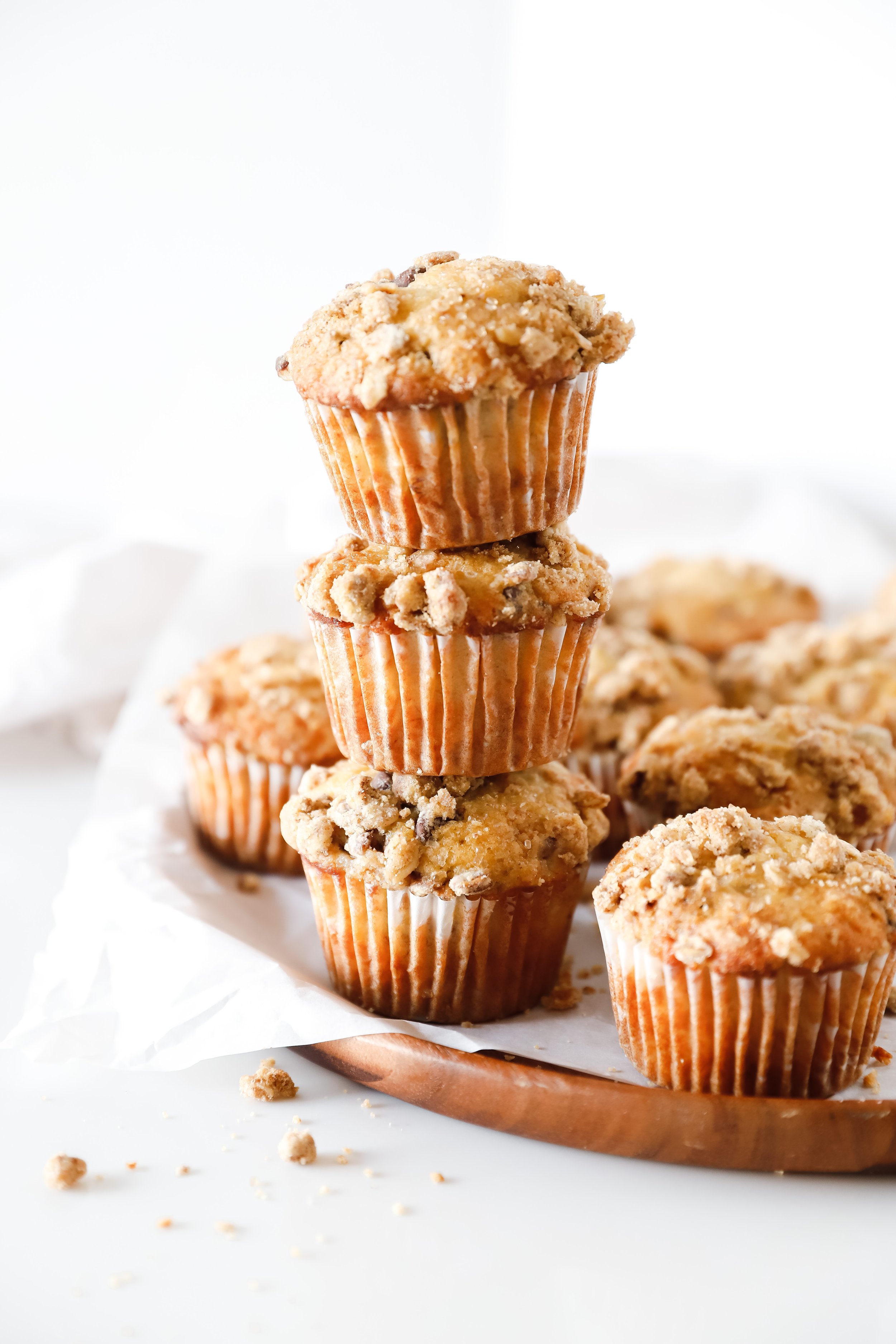 Chocolate chip banana streusel muffins with a crumbly oat topping, fresh out of the oven.