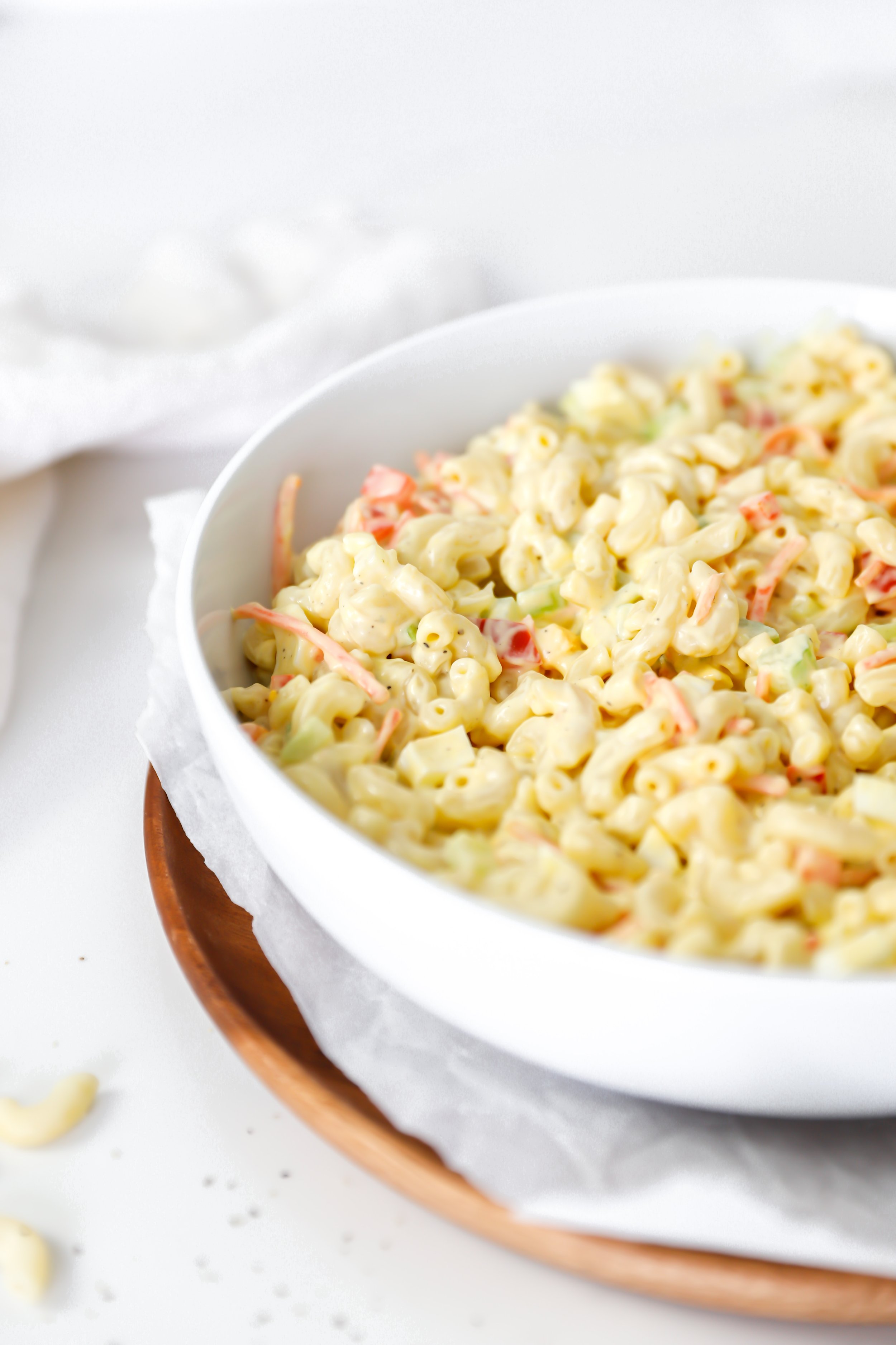 Classic macaroni salad with elbow macaroni, diced vegetables, and a creamy dressing, perfect for summer BBQs and gatherings.