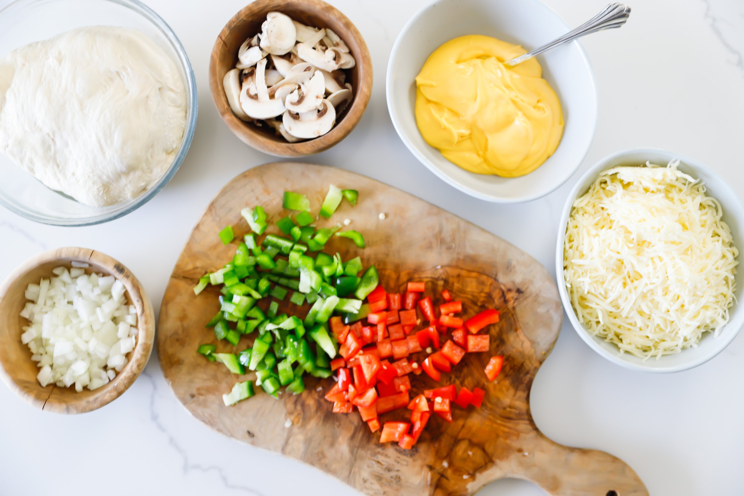 Ingredients to make the perfect philly gheesesteak pinwheels all layed out on the counter.