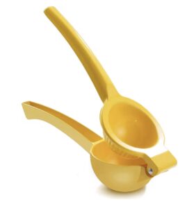 Bright yellow manual citrus press for squeezing fresh citrus juice.